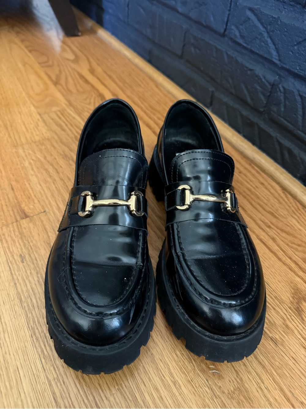 Steve Madden Black Leather Lug-Sole Mules with Gold Horsebit